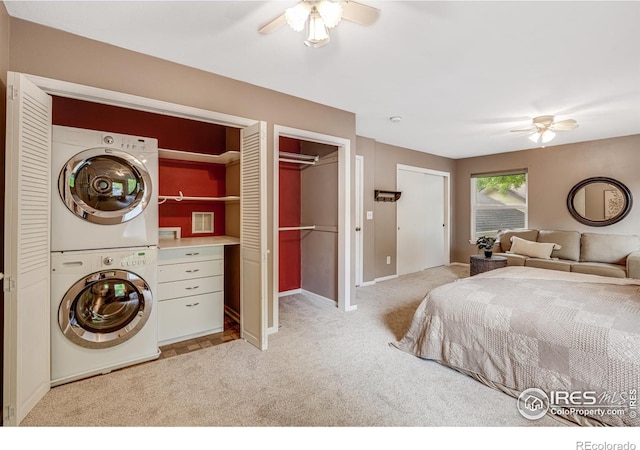 2213 Hiawatha Ct, Fort Collins, CO 80525 - bedroom featuring stacked washer and clothes dryer, carpet floors, and ceiling fan