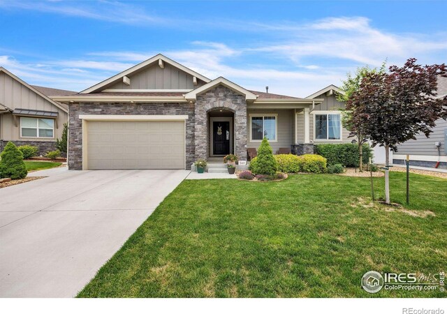 1897 Holloway Dr, Windsor, CO 80550 - craftsman inspired home featuring board and batten siding, stone siding, an attached garage, and a front lawn