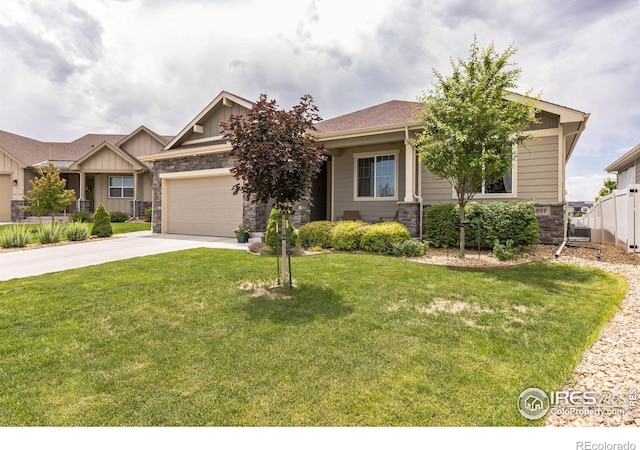1897 Holloway Dr, Windsor, CO 80550 - craftsman-style house featuring stone siding, driveway, a front yard, and a garage