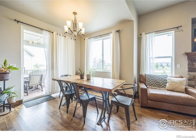 1897 Holloway Dr, Windsor, CO 80550 - dining room featuring a chandelier and wood finished floors