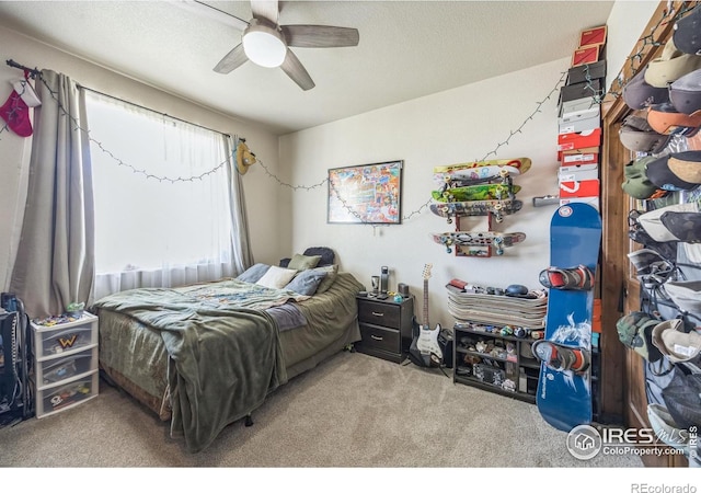 1897 Holloway Dr, Windsor, CO 80550 - bedroom with carpet, ceiling fan, and a textured ceiling