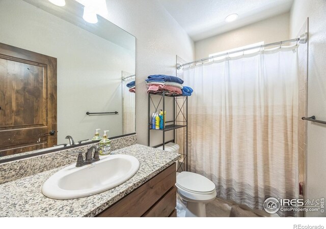 1897 Holloway Dr, Windsor, CO 80550 - full bathroom featuring vanity and toilet