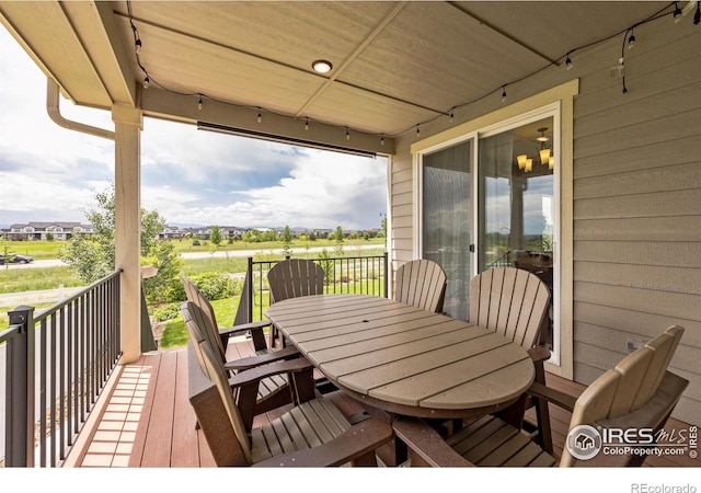 1897 Holloway Dr, Windsor, CO 80550 - wooden deck with outdoor dining area
