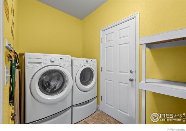 11861 Fairplay St, Commerce City, CO 80603 - washroom with separate washer and dryer and tile patterned floors
