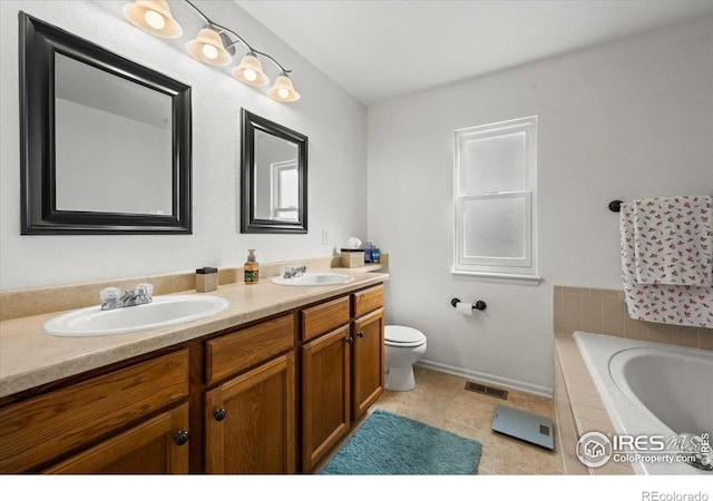 11861 Fairplay St, Commerce City, CO 80603 - bathroom with double vanity and a garden tub