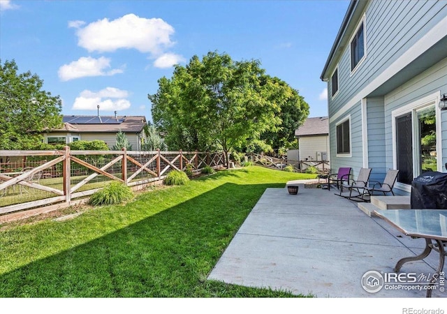 11861 Fairplay St, Commerce City, CO 80603 - fenced backyard with a patio