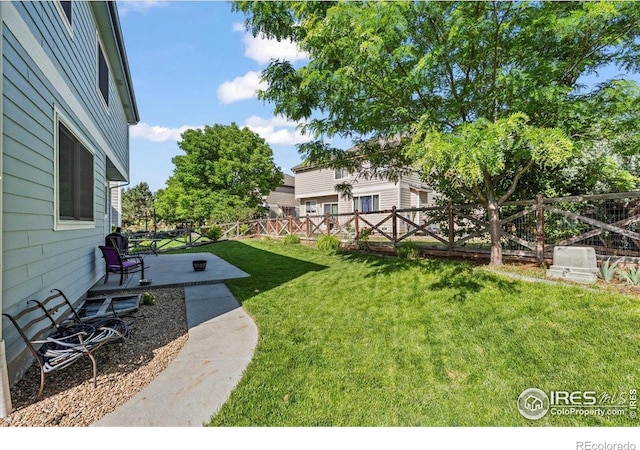 11861 Fairplay St, Commerce City, CO 80603 - fenced backyard with a patio