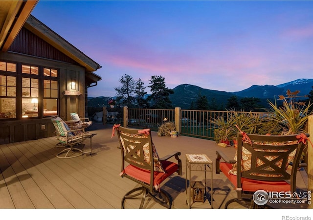 2055 Siskin Dr, Estes Park, CO 80517 - deck at dusk featuring a mountain view