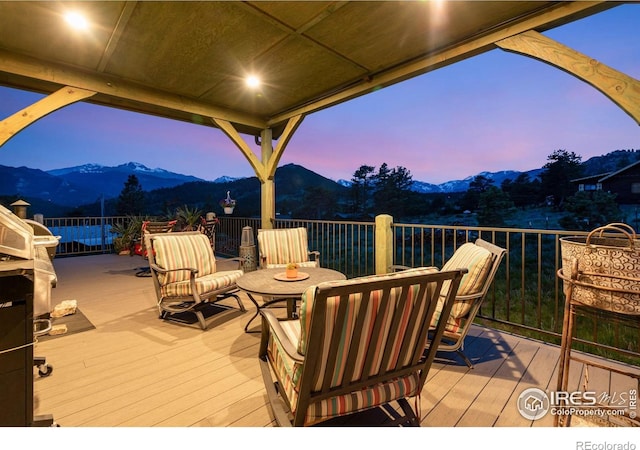 2055 Siskin Dr, Estes Park, CO 80517 - deck at dusk featuring a mountain view