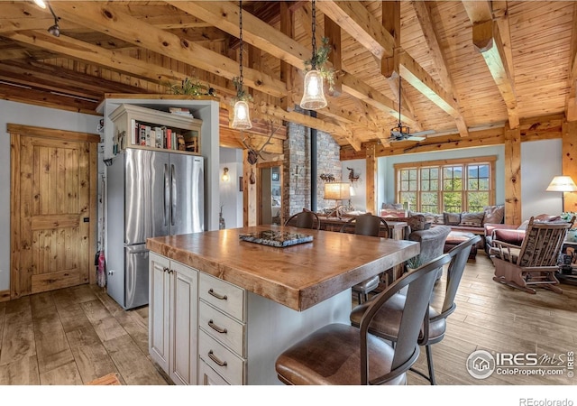 2055 Siskin Dr, Estes Park, CO 80517 - kitchen featuring freestanding refrigerator, wooden ceiling, open floor plan, butcher block counters, and light wood-style flooring