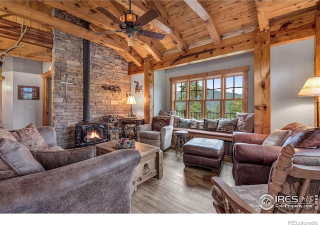 2055 Siskin Dr, Estes Park, CO 80517 - living room featuring wooden ceiling, a wood stove, light wood-type flooring, and a ceiling fan