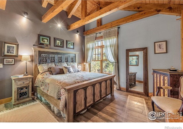 2055 Siskin Dr, Estes Park, CO 80517 - bedroom featuring beam ceiling, wood finished floors, and high vaulted ceiling