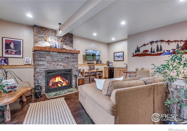 2055 Siskin Dr, Estes Park, CO 80517 - living room with a stone fireplace, beverage cooler, recessed lighting, and beam ceiling