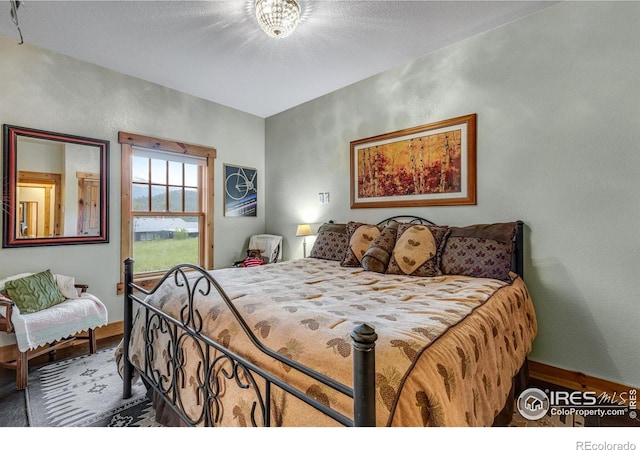 2055 Siskin Dr, Estes Park, CO 80517 - bedroom with wood finished floors and baseboards