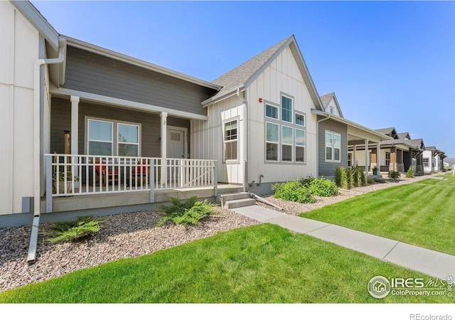 1911 Morningstar Way Unit 2, Fort Collins, CO 80524 - view of front of property featuring a porch, board and batten siding, and a front yard