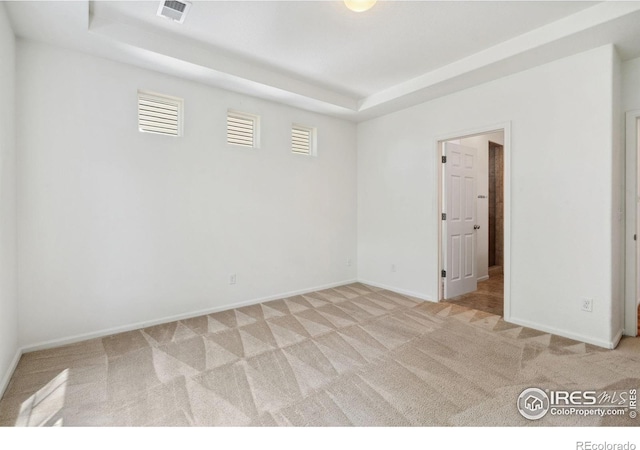 5104 Silverwood Dr, Johnstown, CO 80534 - spare room with light carpet and a tray ceiling