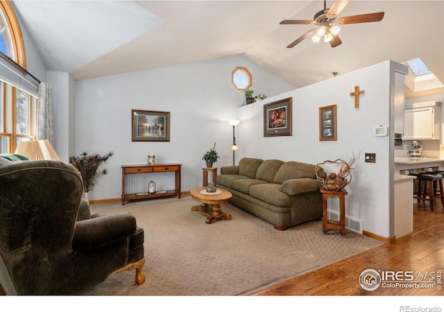 1967 Rangely Ct, Loveland, CO 80538 - living room featuring vaulted ceiling, ceiling fan, and wood finished floors