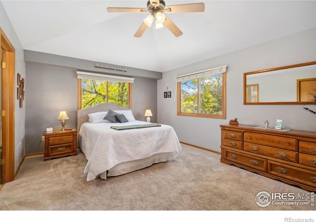 1967 Rangely Ct, Loveland, CO 80538 - carpeted bedroom featuring vaulted ceiling and ceiling fan