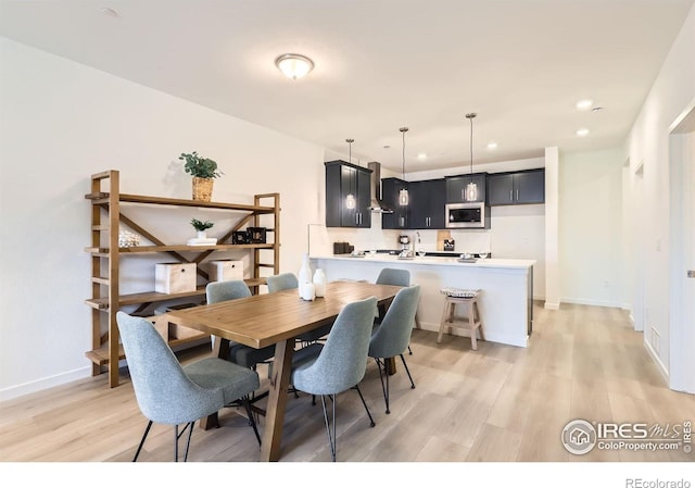 2744 Bear Springs Cir, Longmont, CO 80503 - dining room featuring light wood finished floors and recessed lighting