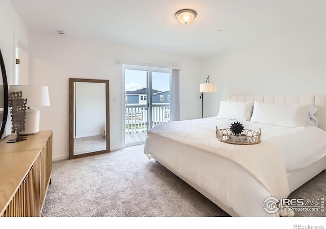2744 Bear Springs Cir, Longmont, CO 80503 - bedroom featuring access to outside and light carpet
