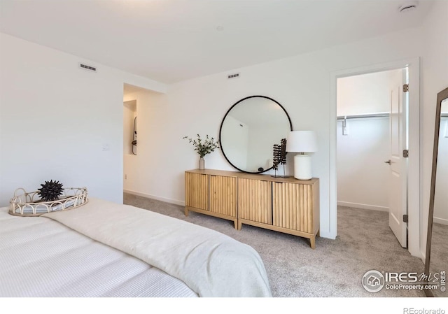 2744 Bear Springs Cir, Longmont, CO 80503 - bedroom featuring light colored carpet, a spacious closet, and a closet