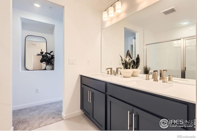 2744 Bear Springs Cir, Longmont, CO 80503 - bathroom featuring double vanity, a shower stall, recessed lighting, and tile patterned floors
