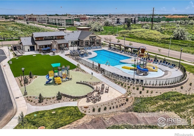 2744 Bear Springs Cir, Longmont, CO 80503 - community pool featuring a patio and a water slide