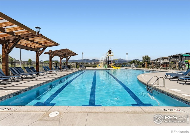 2744 Bear Springs Cir, Longmont, CO 80503 - community pool with a patio area