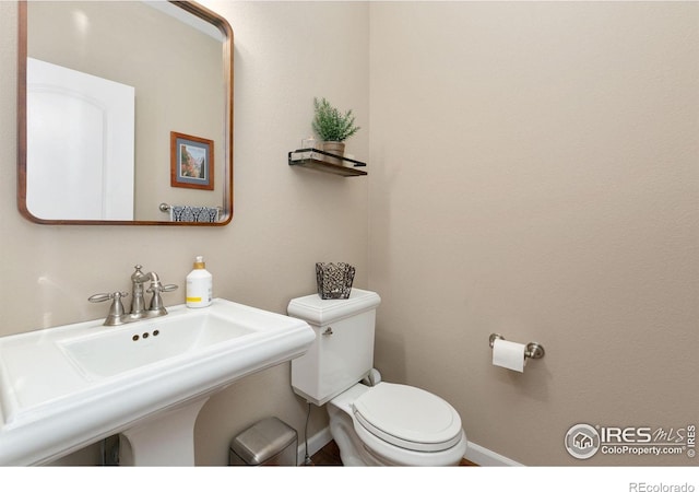 6582 Spanish Bay Dr, Windsor, CO 80550 - half bathroom featuring toilet and baseboards