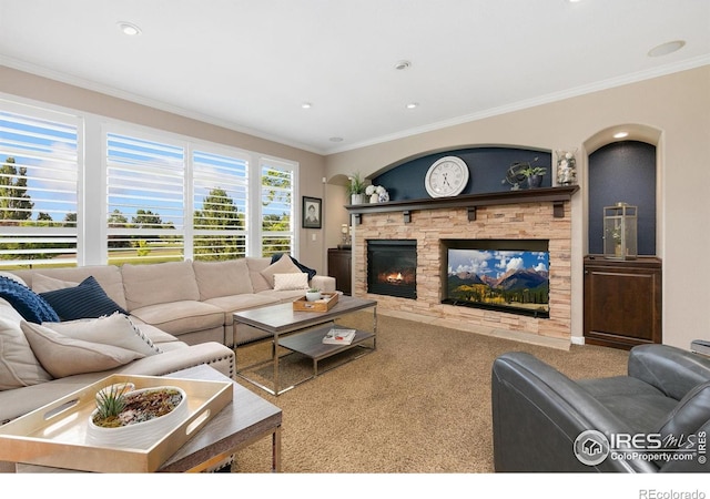 6582 Spanish Bay Dr, Windsor, CO 80550 - living room featuring a fireplace, carpet floors, crown molding, and recessed lighting