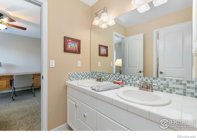 6582 Spanish Bay Dr, Windsor, CO 80550 - bathroom with double vanity, a ceiling fan, and tasteful backsplash