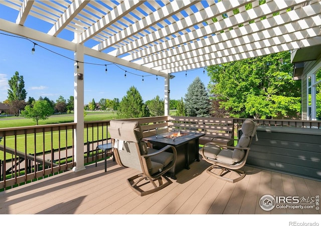 6582 Spanish Bay Dr, Windsor, CO 80550 - wooden terrace with a fire pit, a yard, and a pergola