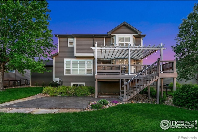 6582 Spanish Bay Dr, Windsor, CO 80550 - rear view of property featuring a pergola, a patio area, stairway, and a yard