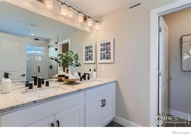 2770 Bear Springs Cir, Longmont, CO 80503 - bathroom featuring double vanity and a shower stall