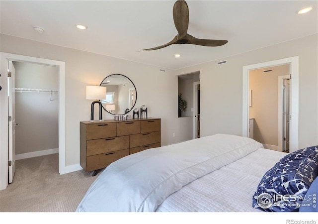 2770 Bear Springs Cir, Longmont, CO 80503 - bedroom featuring light carpet, a walk in closet, recessed lighting, a closet, and a ceiling fan