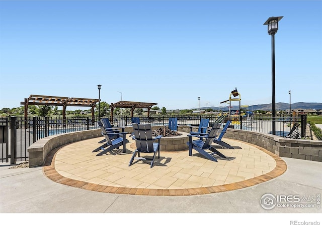 2770 Bear Springs Cir, Longmont, CO 80503 - view of patio with an outdoor fire pit and a pergola