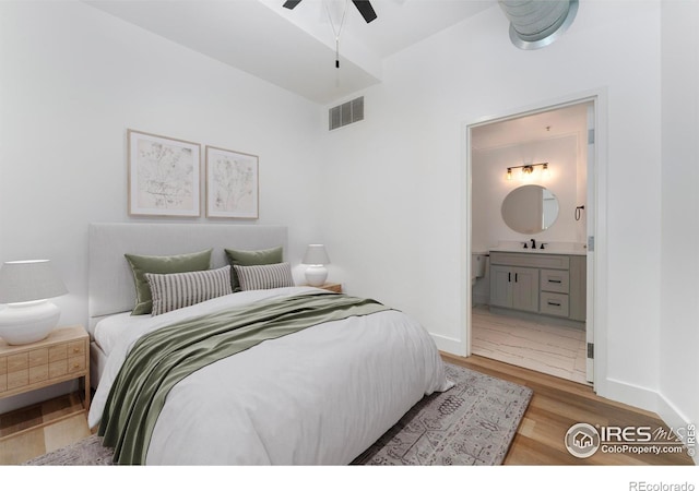 3100 Huron St Unit 1D, Denver, CO 80202 - bedroom featuring ensuite bath and light wood finished floors