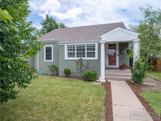 1750 Trenton St, Denver, CO 80220 - view of front of house featuring roof with shingles and stucco siding