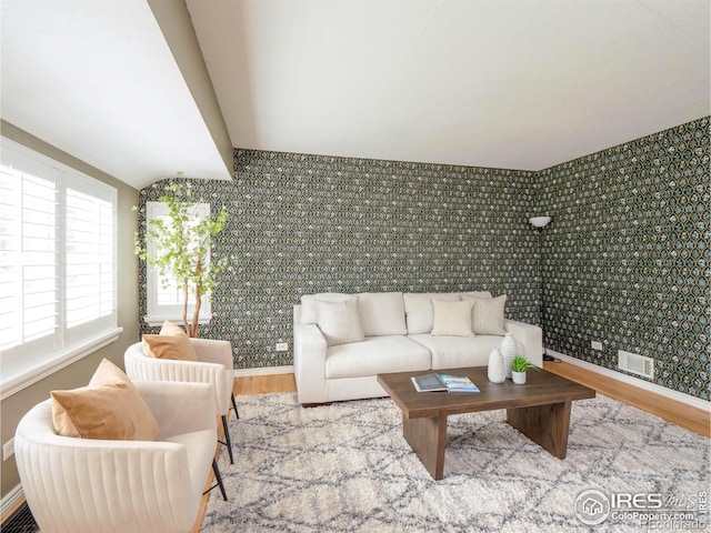 1750 Trenton St, Denver, CO 80220 - living room with wood finished floors and an accent wall