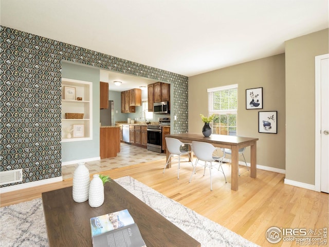 1750 Trenton St, Denver, CO 80220 - living area with light wood-type flooring and baseboards