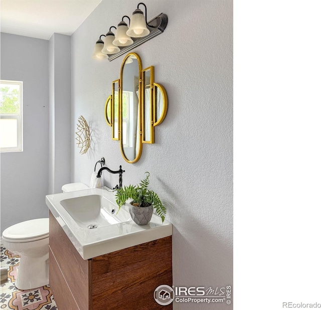 1750 Trenton St, Denver, CO 80220 - half bathroom with vanity and toilet