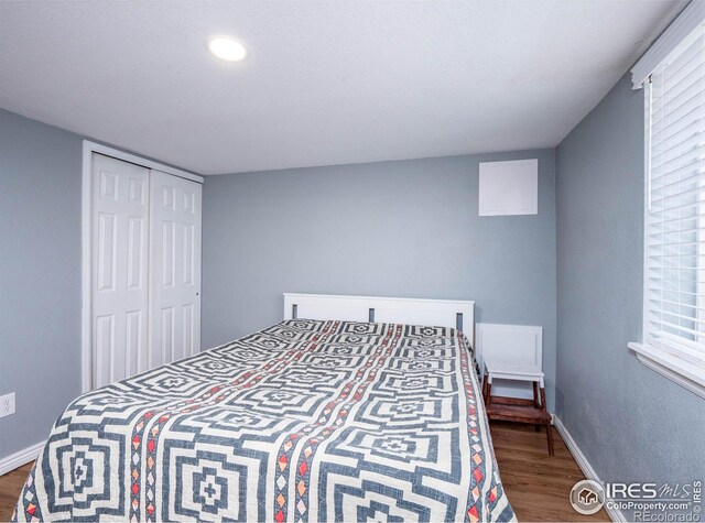 1750 Trenton St, Denver, CO 80220 - bedroom featuring wood finished floors and a closet