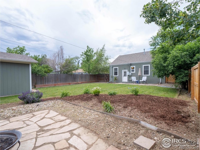 1750 Trenton St, Denver, CO 80220 - fenced backyard featuring a patio area