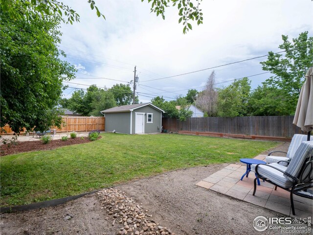 1750 Trenton St, Denver, CO 80220 - fenced backyard with a patio area and a storage unit