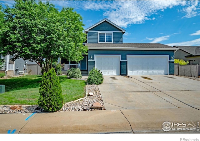 3268 White Buffalo Dr, Wellington, CO 80549 - view of front of property featuring concrete driveway and a garage