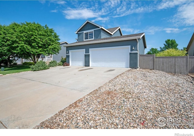 3268 White Buffalo Dr, Wellington, CO 80549 - view of front of property featuring concrete driveway, a garage, and roof with shingles