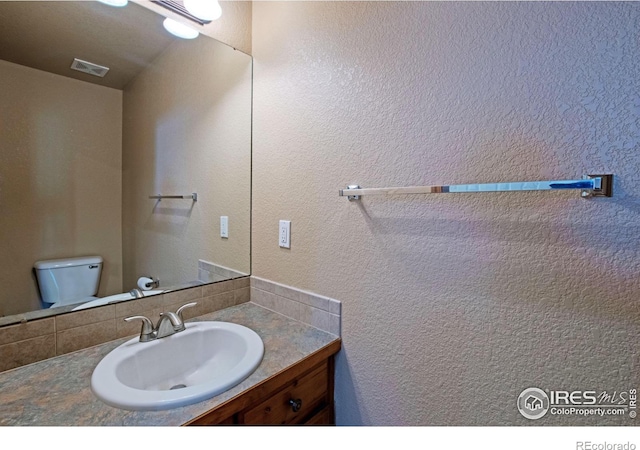 3268 White Buffalo Dr, Wellington, CO 80549 - half bathroom with vanity and toilet