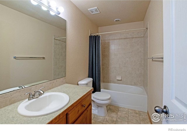 3268 White Buffalo Dr, Wellington, CO 80549 - full bathroom featuring vanity, shower / bath combo, tile patterned floors, and a textured wall