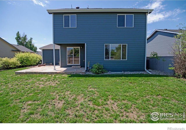 3268 White Buffalo Dr, Wellington, CO 80549 - back of house featuring a patio area