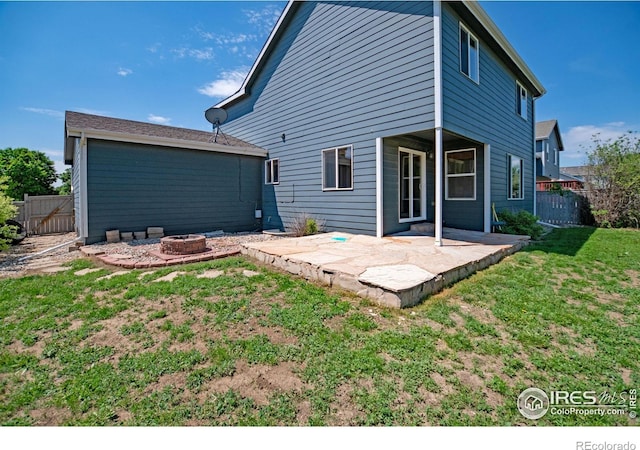 3268 White Buffalo Dr, Wellington, CO 80549 - rear view of property with a fire pit and a patio